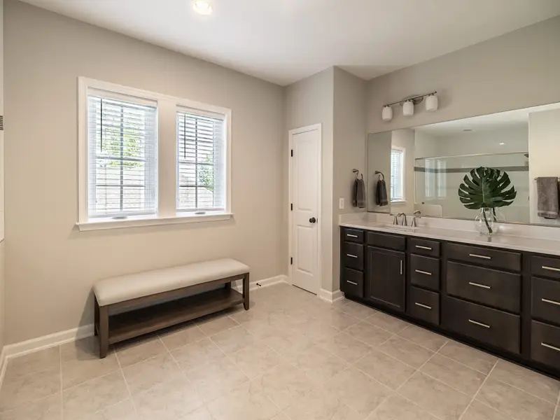 Primary Bath - Double vanity with generous counter space, steps from the primary bedroom.