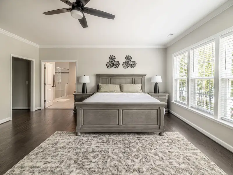 Primary Suite - A serene retreat with a king bed, private sitting area, and abundant natural light.