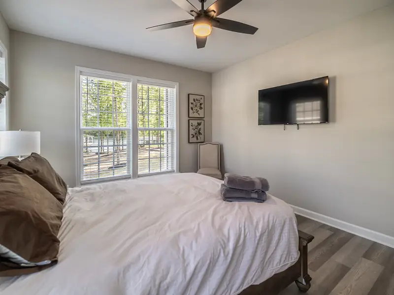 Bedroom 5 - A bright, comfortable room with a plush bed and lots of natural light.