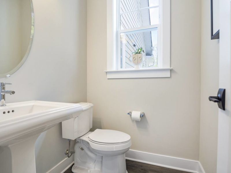 Half Bath is located on the main level conveniently located near the kitchen, living room, and laundry room.