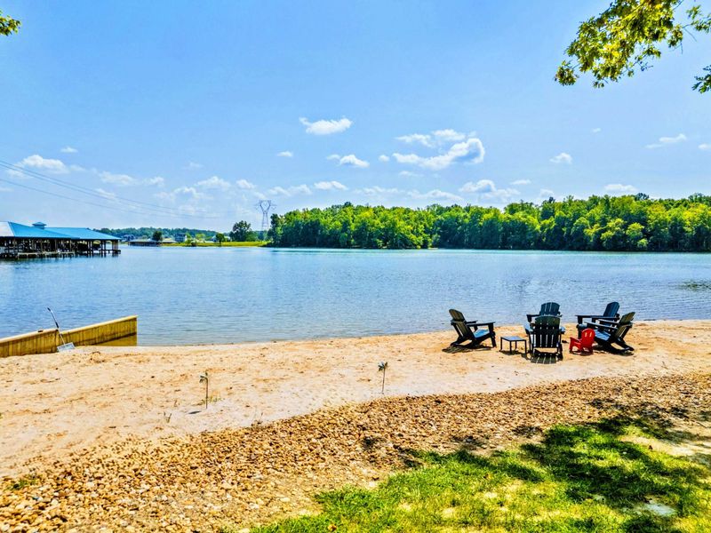 120 Foot Private Beach! You will love the 160+ feet of lakefront shoreline with a gently sloped naturally sandy lake bottom, and warm freshwater.