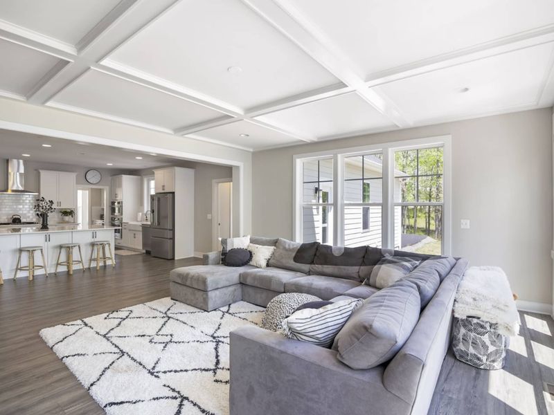 Open living room with amazing water views, comfy couch, Smart TV, and gas fireplace.