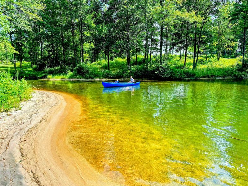 120 Foot Private Beach! You will love the 160+ feet of lakefront shoreline with a gently sloped naturally sandy lake bottom, and warm freshwater.