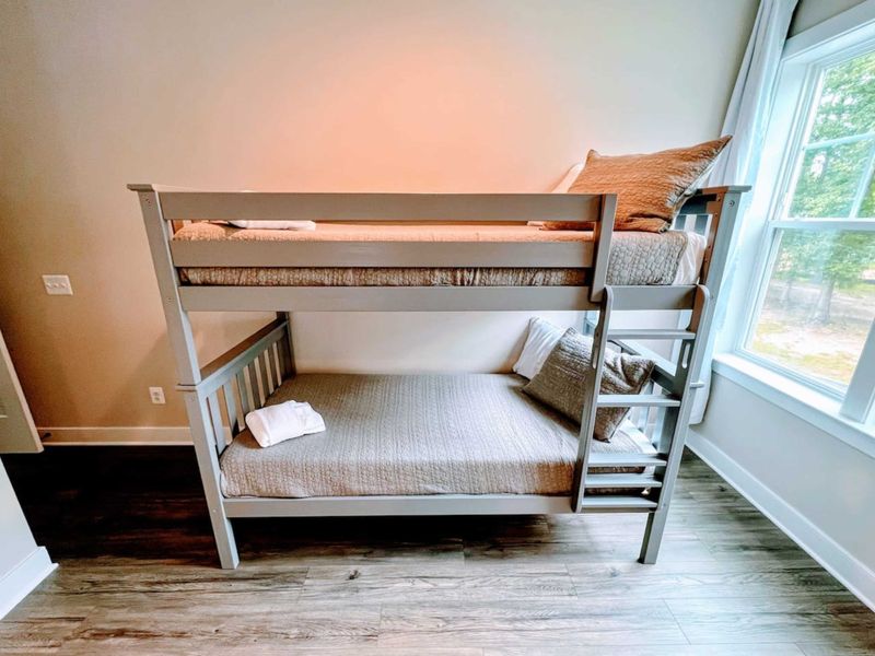 Upstairs King + Bunk bedroom with a cozy bathroom en suite.