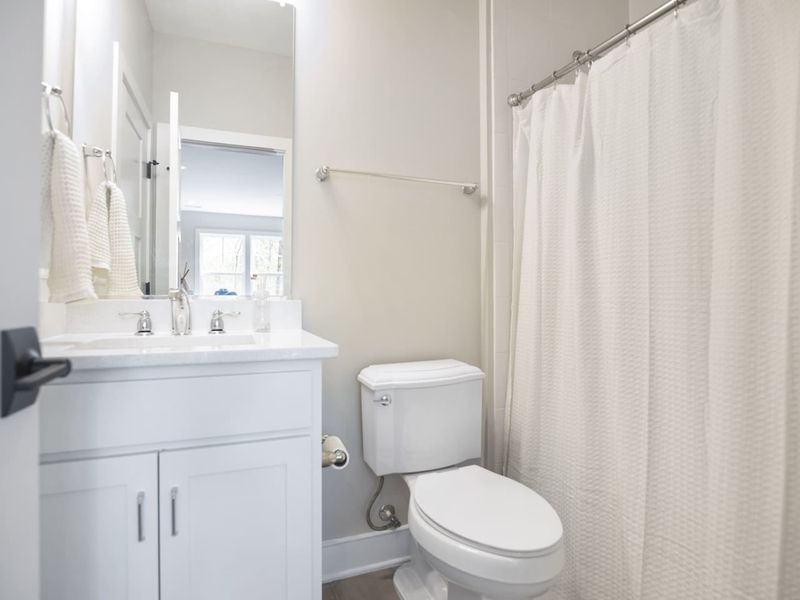 Upstairs King + Bunk bedroom with a cozy bathroom en suite.