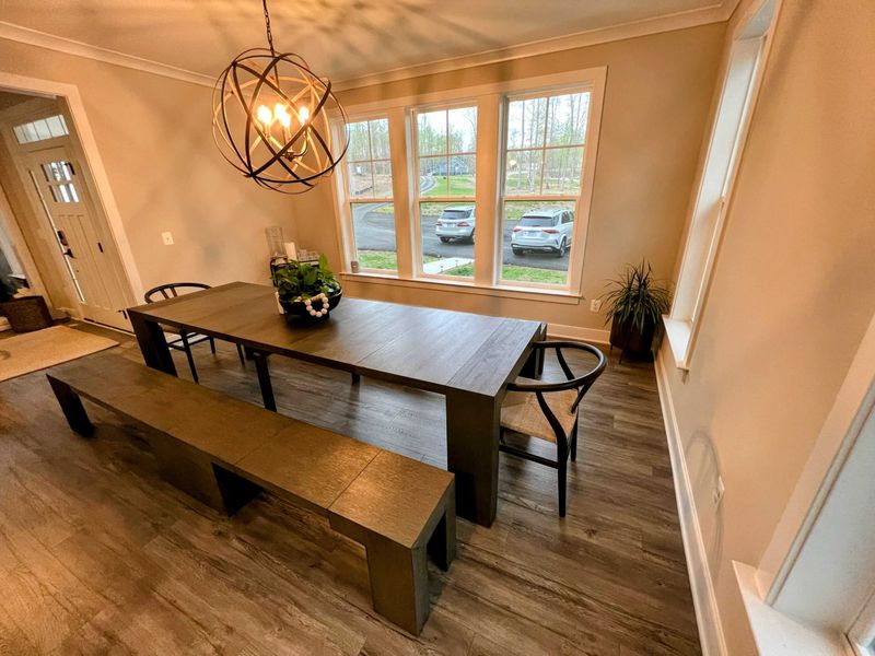 Dining room with real wood table that seats up to 12 people.