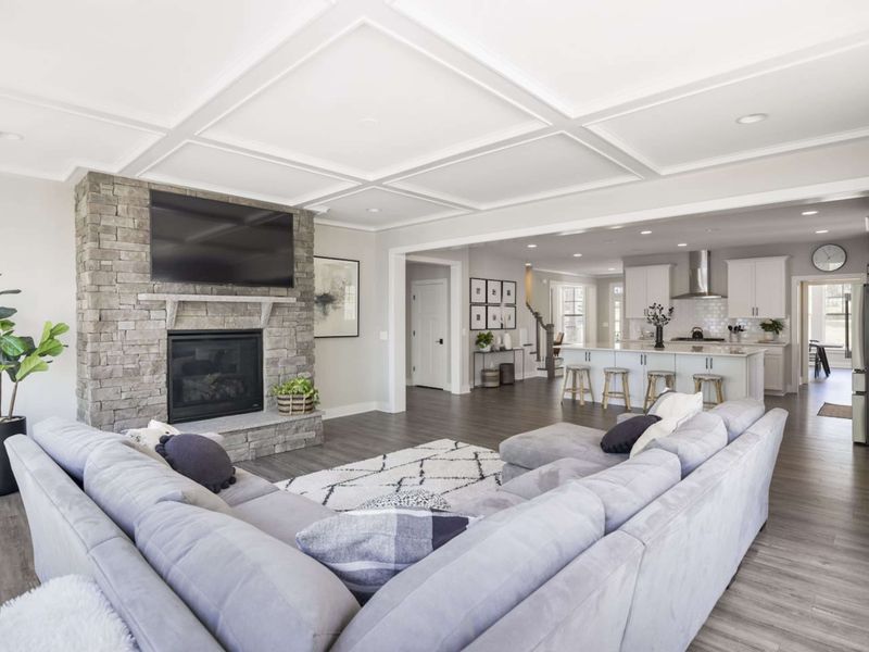 Open living room with amazing water views, comfy couch, Smart TV, and gas fireplace.