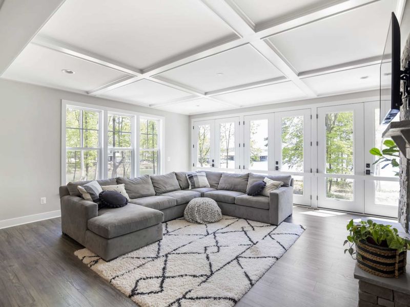 Open living room with amazing water views, comfy couch, Smart TV, and gas fireplace.