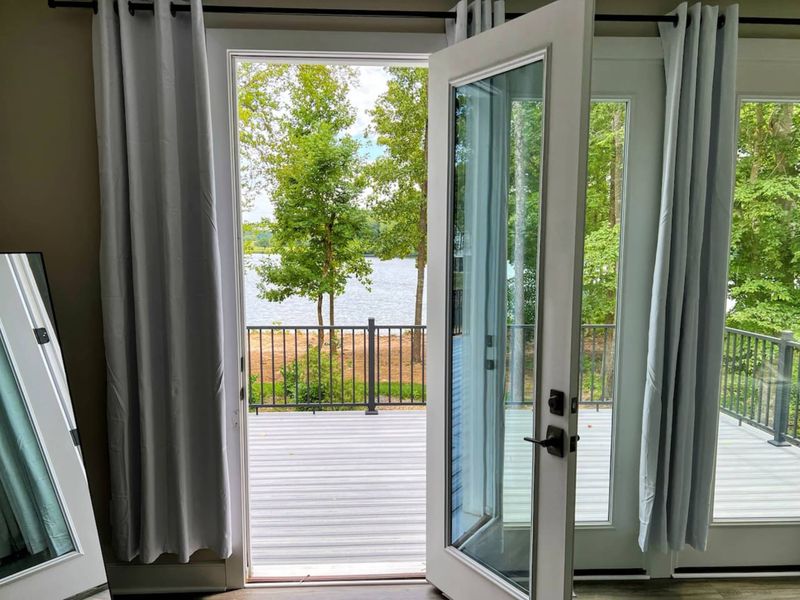 Large Primary Suite with easy access to the large deck and gorgeous water views.