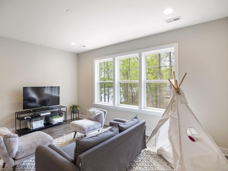Upstairs secondary living area with TV and Xbox.