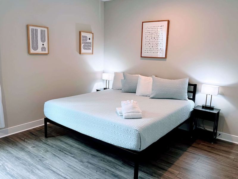 Upstairs King + Bunk bedroom with a cozy bathroom en suite.