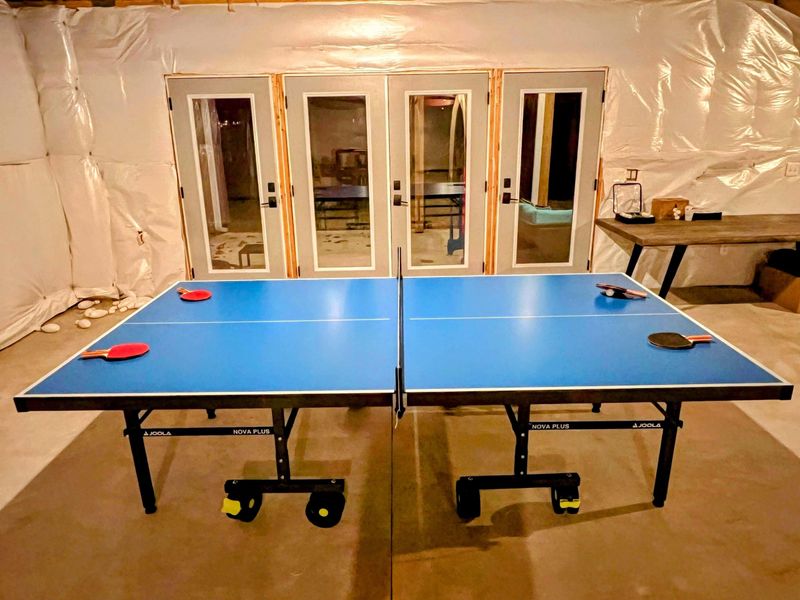 Challenge your friends and family to a game of ping pong in this fun indoor space. Whether you're looking for some friendly competition or just a casual match, this area is the perfect spot to unwind and have a great time. Let the fun begin! ✨