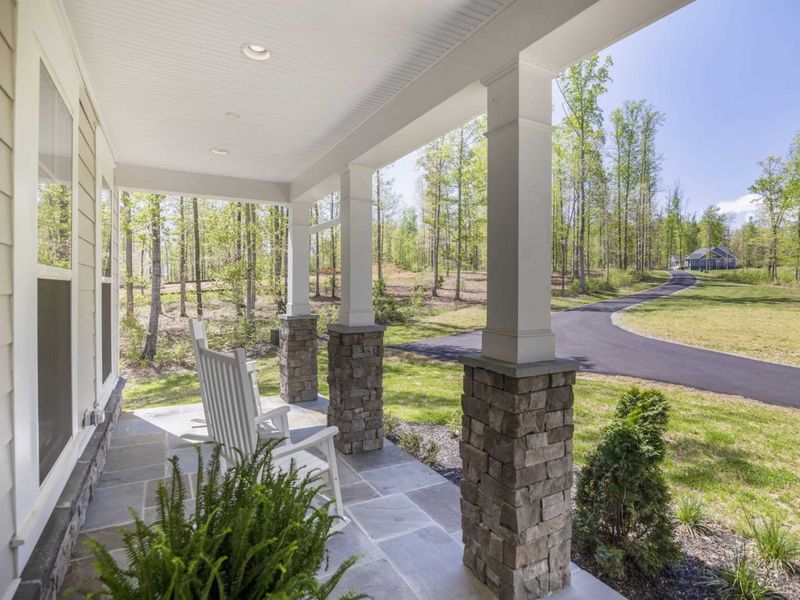 Front porch is perfect for relaxing, bird watching, or reading a book.