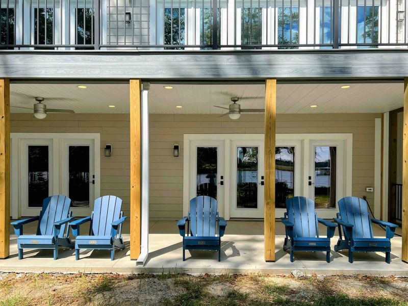 Relax on an adirondack chair on our new large covered patio!