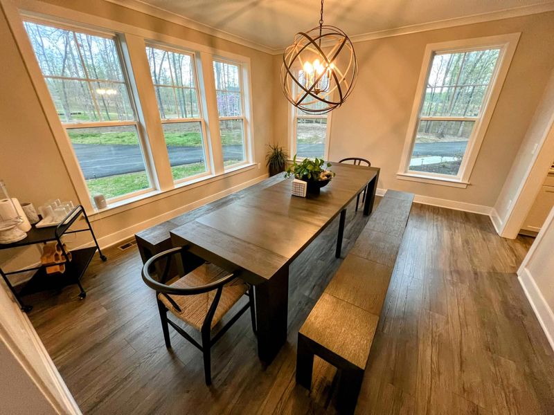Dining room with real wood table that seats up to 12 people.