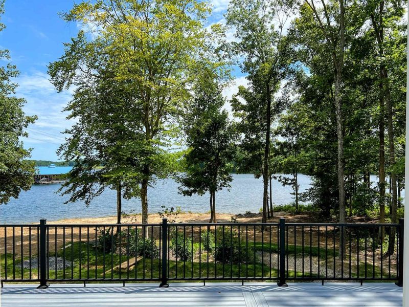 Large Primary Suite with easy access to the large deck and gorgeous water views.