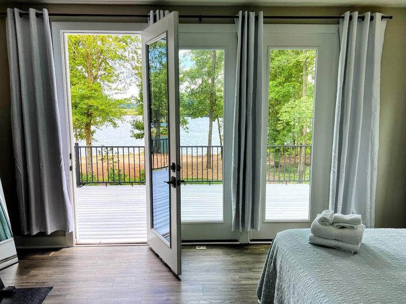 Large Primary Suite with easy access to the large deck and gorgeous water views.