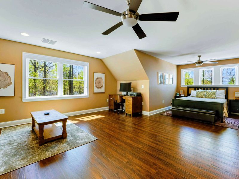 Large upper level suite with queen bed, fully stocked kitchen, desk, and bathroom.