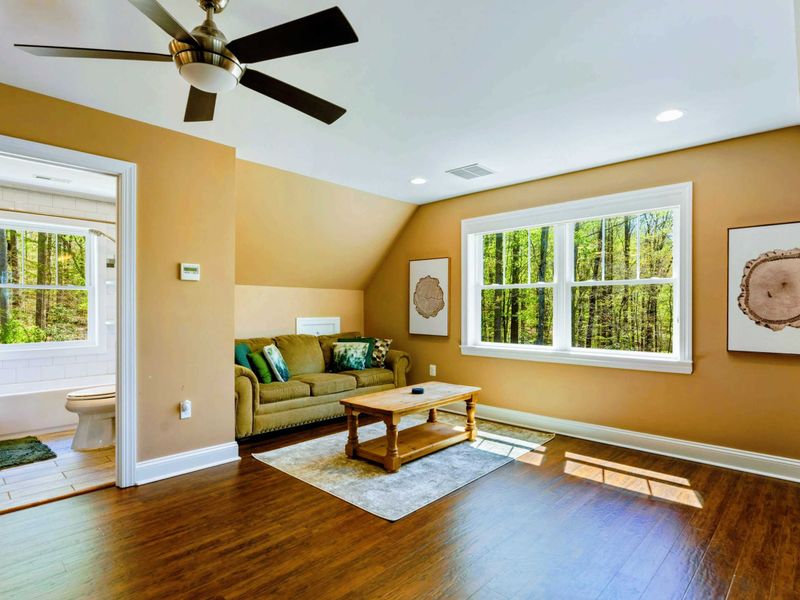 Large upper level suite with queen bed, fully stocked kitchen, desk, and bathroom.