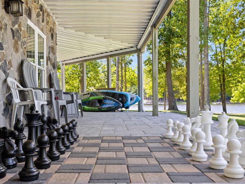 Savor the thrill of a chess match beneath the cool shade of our deck, all while relishing the captivating panorama of the tranquil lake.