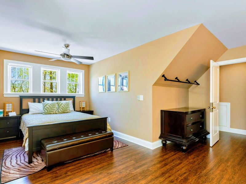 Large upper level suite with queen bed, fully stocked kitchen, desk, and bathroom.