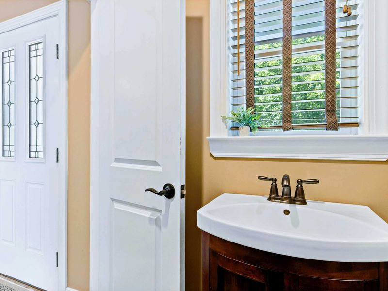 Powder room near front entrance on main level.