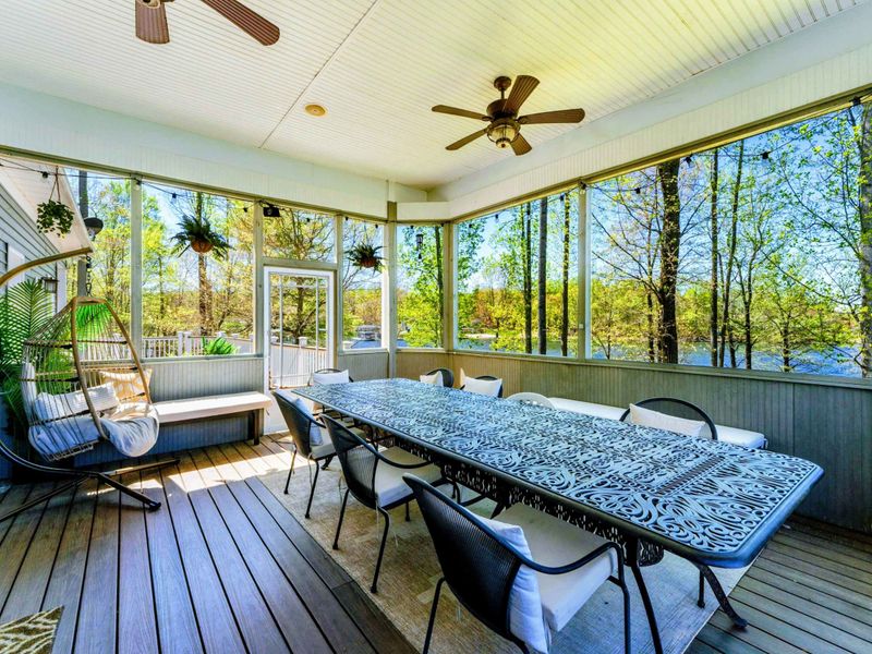 Indulge in lakeside feasts within confines of our screened-in porch with seating for up to 14.