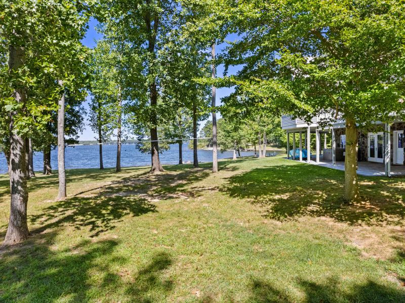 Immerse yourself in pure enjoyment as you bask in the beauty of our spacious backyard, boasting breathtaking lake views!