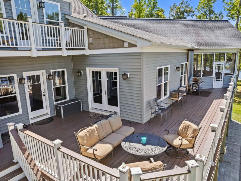 Unwind in style on our deck adorned with plush, comfortable chairs, where every seat is a front-row view to the breathtaking lake.