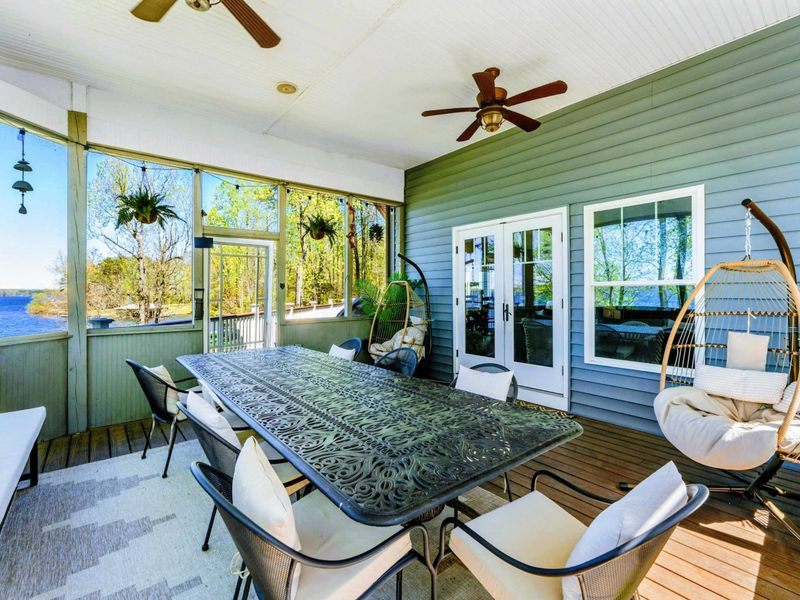 Indulge in lakeside feasts within confines of our screened-in porch with seating for up to 14.