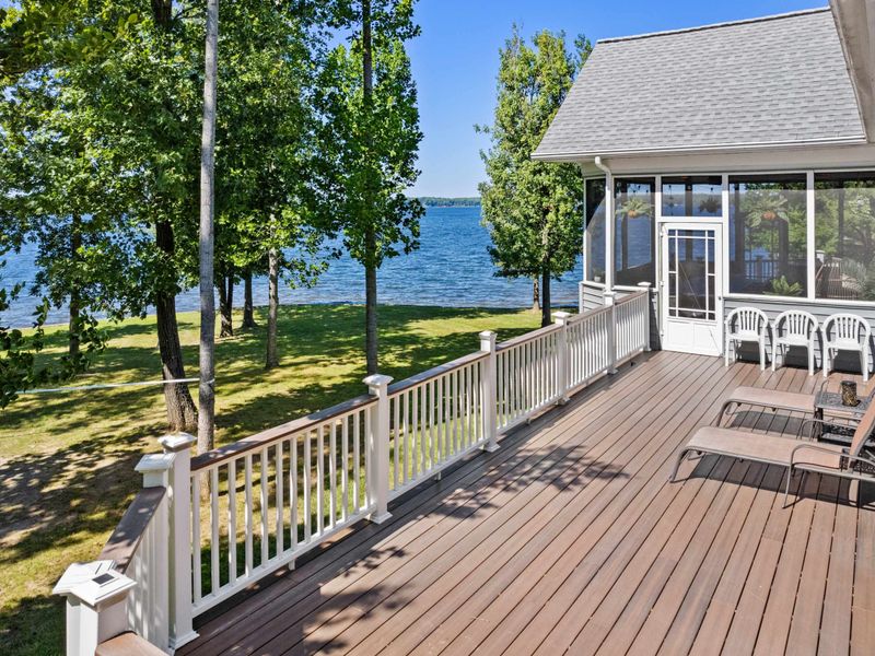 Unwind in style on our deck adorned with plush, comfortable chairs, where every seat is a front-row view to the breathtaking lake.