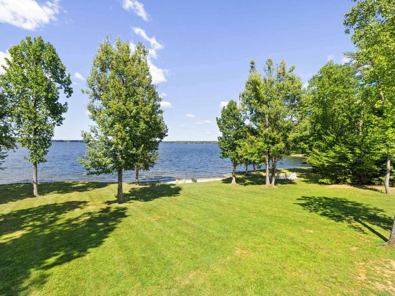 Immerse yourself in pure enjoyment as you bask in the beauty of our spacious backyard, boasting breathtaking lake views!