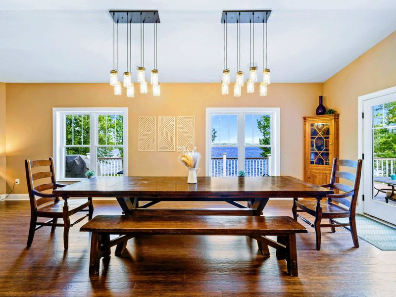 Savor culinary delights while feasting your eyes on stunning lake views in our spacious dining room, perfectly set for 10.