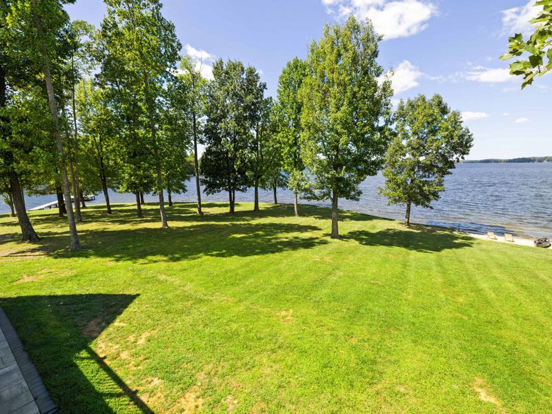 Immerse yourself in pure enjoyment as you bask in the beauty of our spacious backyard, boasting breathtaking lake views!