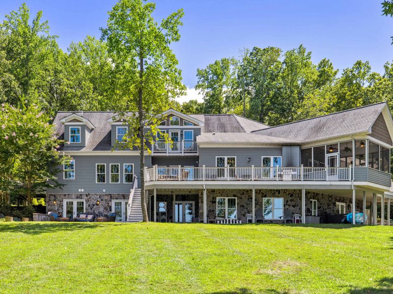 Immerse yourself in pure enjoyment as you bask in the beauty of our spacious backyard, boasting breathtaking lake views!