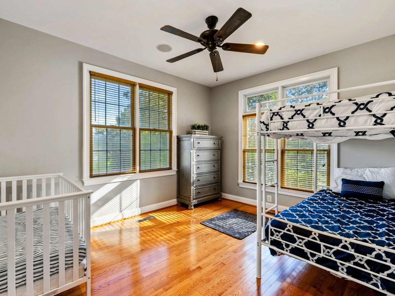 Bunk Room - A twin-over-full bunk bed, a crib, and natural light from two windows make this the kids' corner.