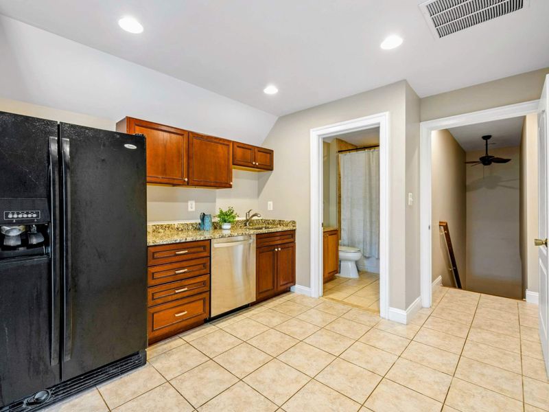 Upper Suite Kitchenette - A full-size fridge, dishwasher, and coffee station make this upper-level suite self-contained.