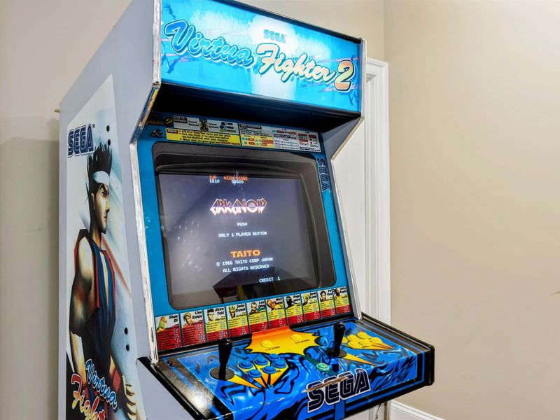 Game Room - A Sega Virtua Fighter 2 arcade cabinet brings vintage gaming to the mix.