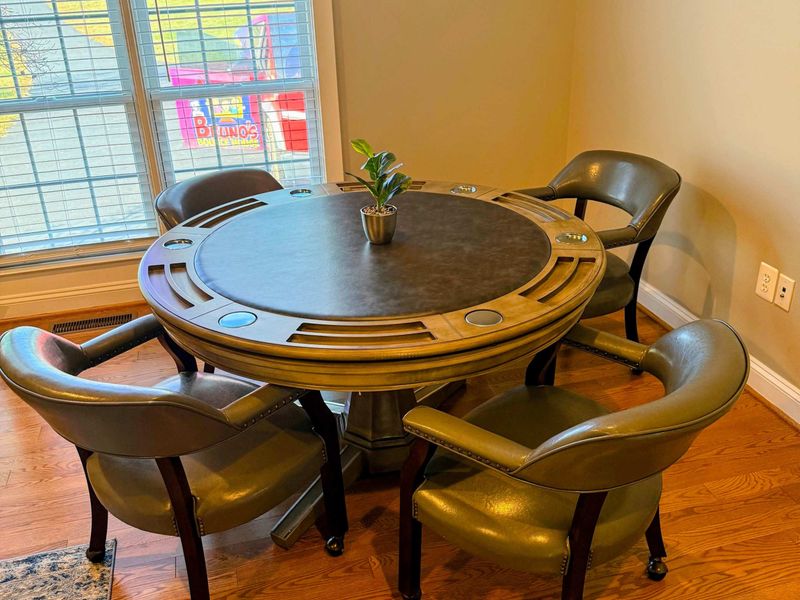 Office - A poker table with leather rolling chairs, perfect for game nights or cards after dinner.