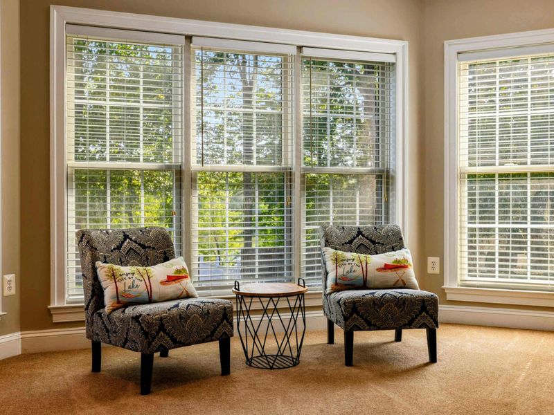 Lake Level Bedroom - The sitting nook in the bay window offers a quiet reading spot steps from the bed.