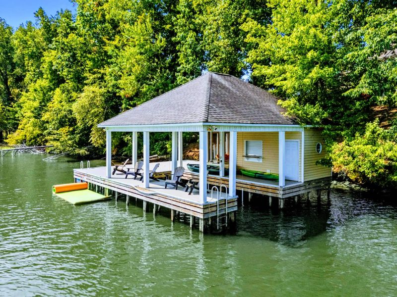 Boathouse - A closer look at the covered dock with lounge chairs, kayak, and a direct view across the cove.