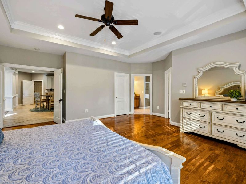 Ensuite 2 - From the foot of the bed, the open floor plan leads to the dining area and attached bunk room.