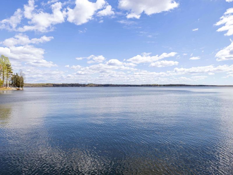 Breathtaking panoramic lake views under a wide blue sky, perfect for relaxation and contemplation