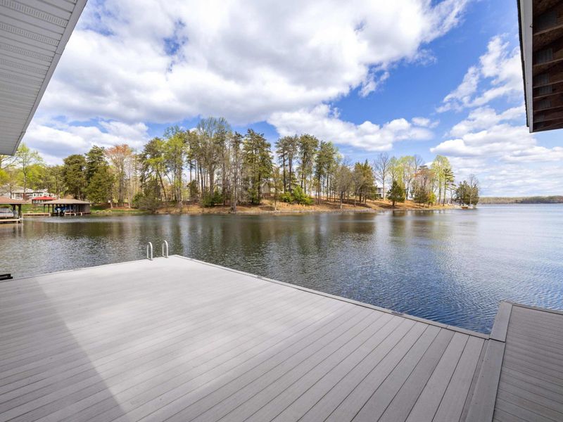 Expansive dock view offering a tranquil lake vista and a touch of nature’s beauty