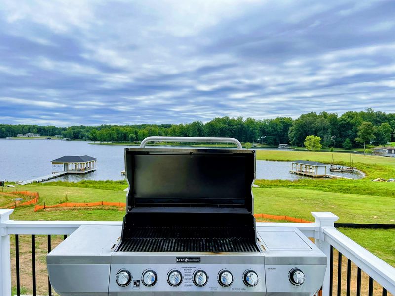 Patio - A built-in grill station on the back deck keeps every summer cookout a few steps from the lake view.