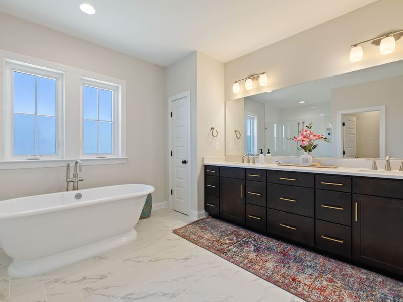 Primary Suite - Dual vanities, quartz counters, and plenty of counter space for the morning routine.