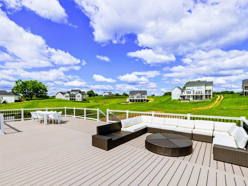 Backyard - Your custom boathouse holds boats below and a full rooftop lounge above, all set up for a day on the lake.