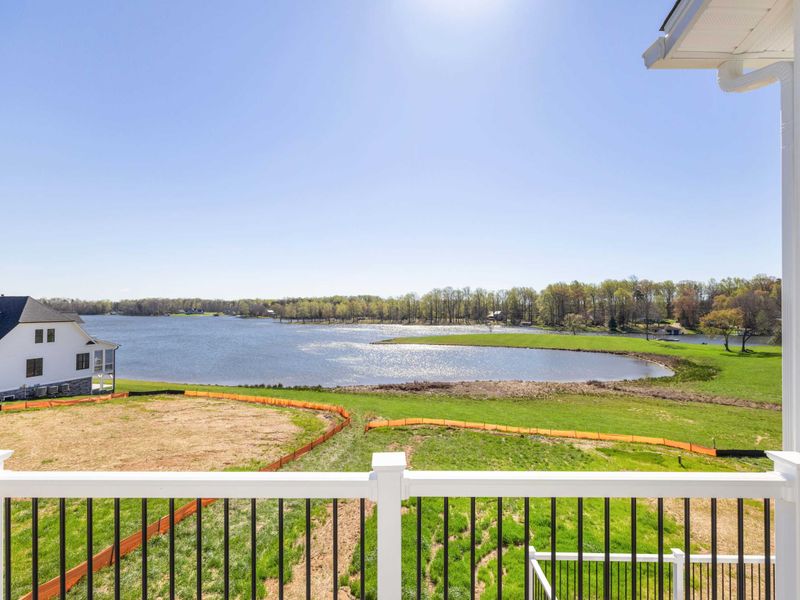 Primary Suite - Step out onto the private balcony for an unobstructed view of Lake Anna and the cove below.