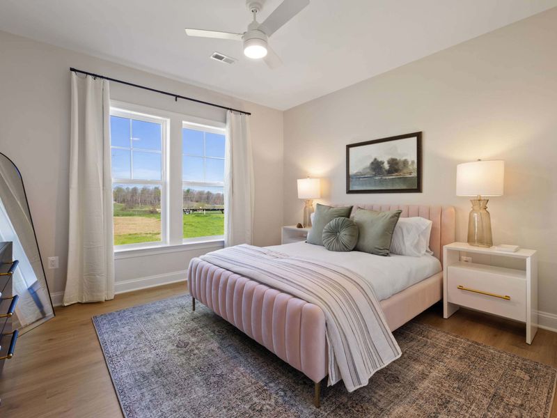 Suite #4 - A queen bedroom with a pair of nightstands, a bright window, and easy access to the ensuite bath.