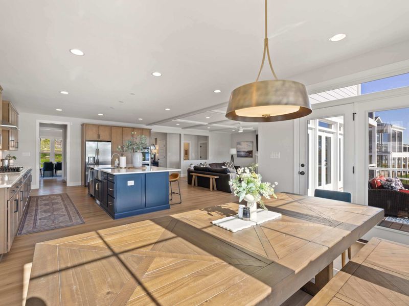 Great Room Dining Area - From the kitchen looking across the dining table, an uninterrupted flow from prep to plate to view.